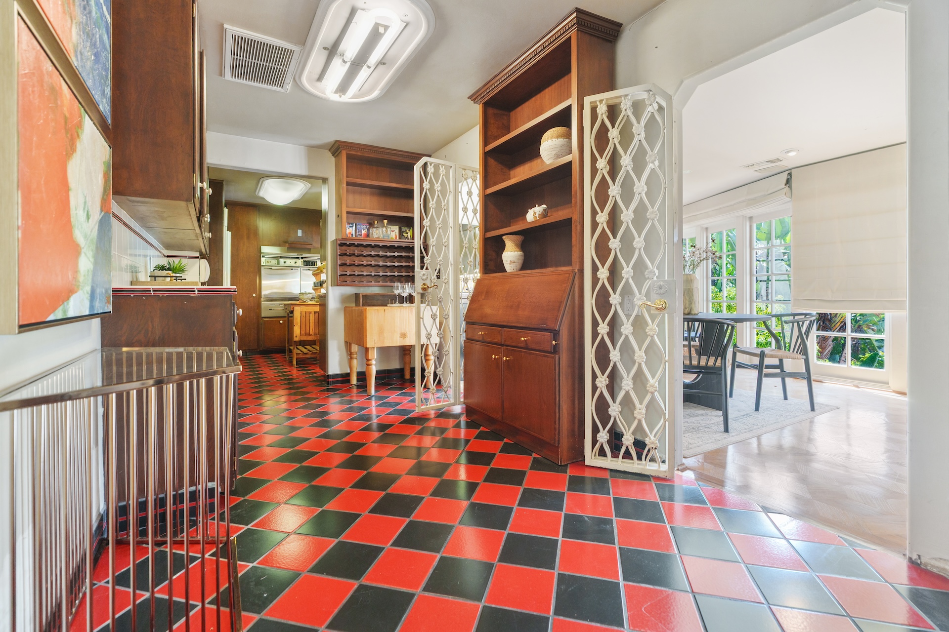 Kitchen and service hall — a signature checkerboard floor